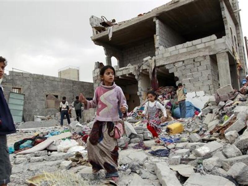 A child stands on a bombed building in Yemen. (AFP/File)