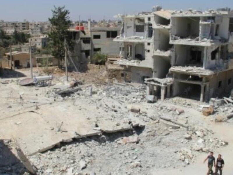 The Syrian town of Deraa, which has seen intensified shelling and aerial bombardment, is just a few kilometers away from Jordan's border town of Ramtha. (AFP/File)