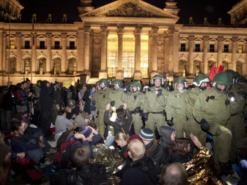 No longer a 'Wall' to occupy or tear down, Berlin keeps the peace, not wishing to give Iran another chance at a quip to 
the 'Western' police- handling of riots. Frankfurt -  the Euro-zone's financial hub - joined Europe's mainly peaceful assemblies in voicing objection to the perceived social injustice in the people- versus- banks stand-off.