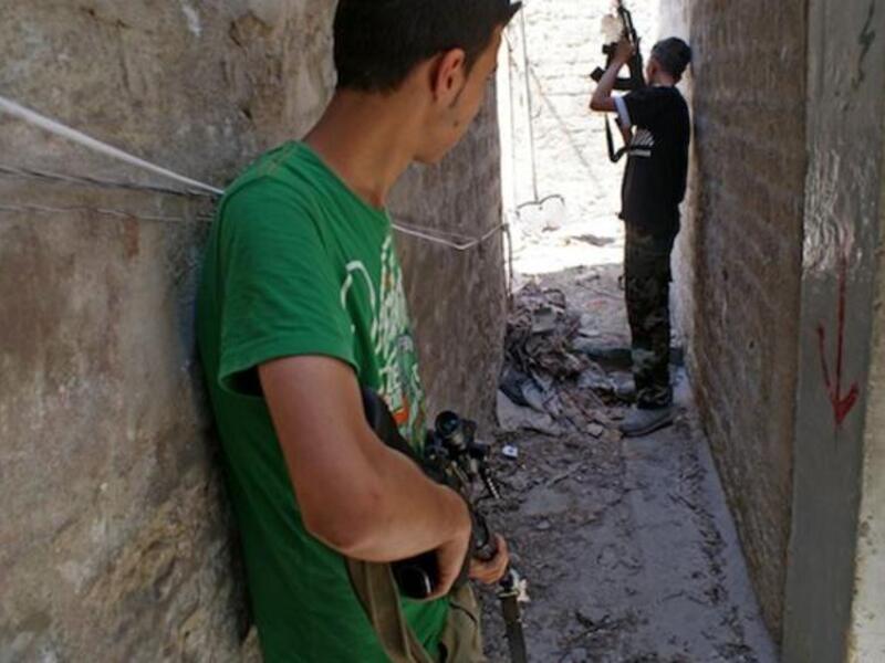 A picture from the opposition-run Shaam News Network shows rebel fighters in the northern city of Aleppo on June 24, 2013. (Source: AFP / HO / SHAAM NEWS NETWORK)