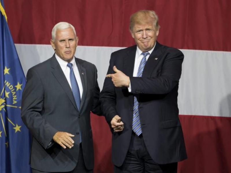Indiana Governor Mike Pence, on left. (Photo: TASOS KATOPODIS/AFP/GETTY IMAGES)