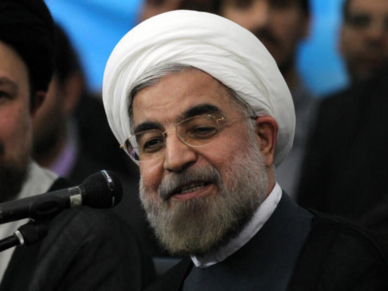 Iranian president-elect Hassan Rouhani speaks to the press following a visit to the Khomeini mausoleum, in Tehran on June 16 (Atta Kenare / AFP)