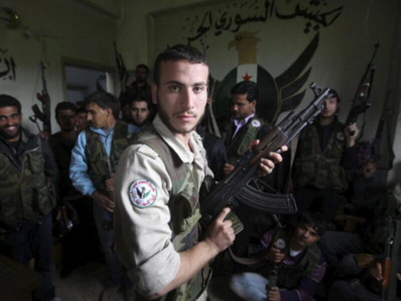 Free Syrian Army members at their base on April 21, 2013, in Darkoush, Syria. [Getty Images]