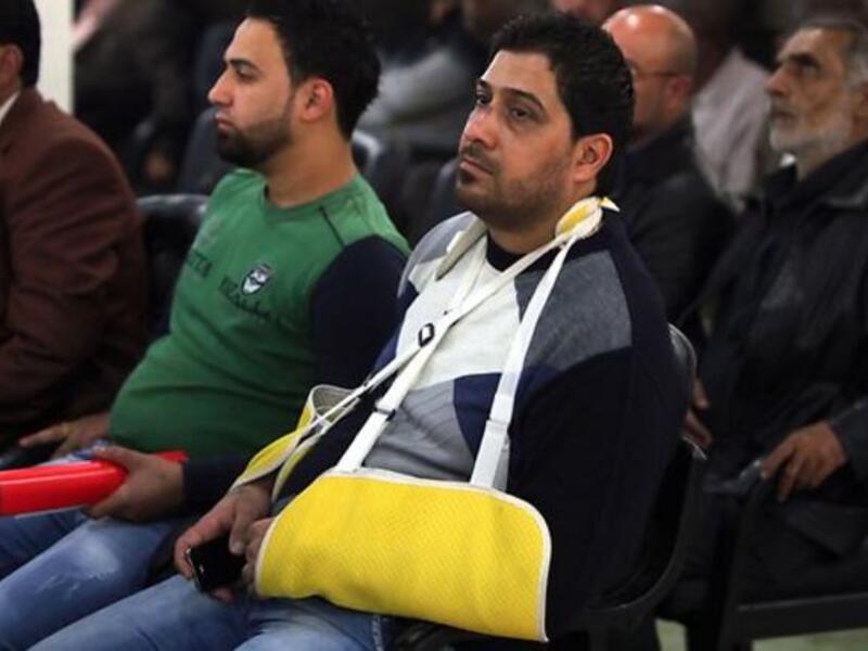 An Iraqi cafe owner injured in an bomb attack attends a seminar for owners. [resources1]
