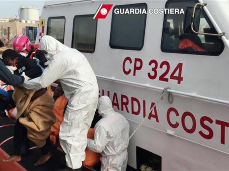 In this handout video capture released by the Italian Coast Guard on April 30, 2016, refugees arrive at Lampedusa harbor after a rescue operation at sea, off the coast of Libya. (AFP/File)
