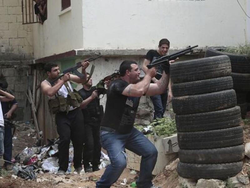 Gunmen fire during clashes between supporters and opponents of the Syrian government in northern Lebanon. [presstv]