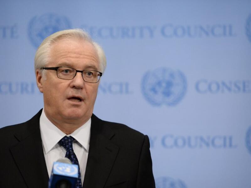 Vitaly Churkin, Russia's Ambassador to the United Nations, speaks to the media after a closed-door meeting of the Security Council on Syria December 16, 2013. [AFP]