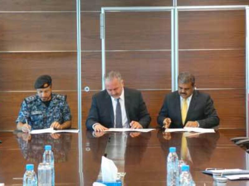 Colonel Sameer Jassim Showaiter, Mr. Mohamed Ahmed Mohamed Yateem and Mr. Silvan Varghese during the signing.