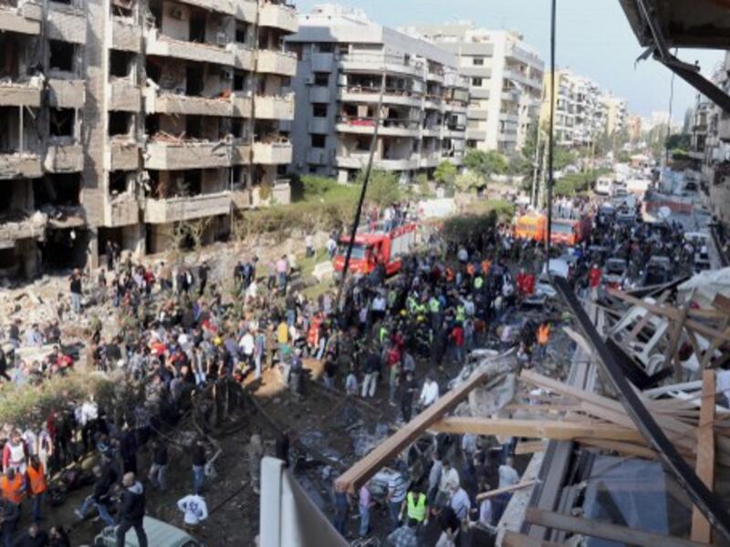 People gather at the site of a blast in Bir Hassan neighbourhood in southern Beirut on November 19, 2013. At least 22 people were killed in a double bomb attack outside the Iranian embassy in Beirut. (AFP)
