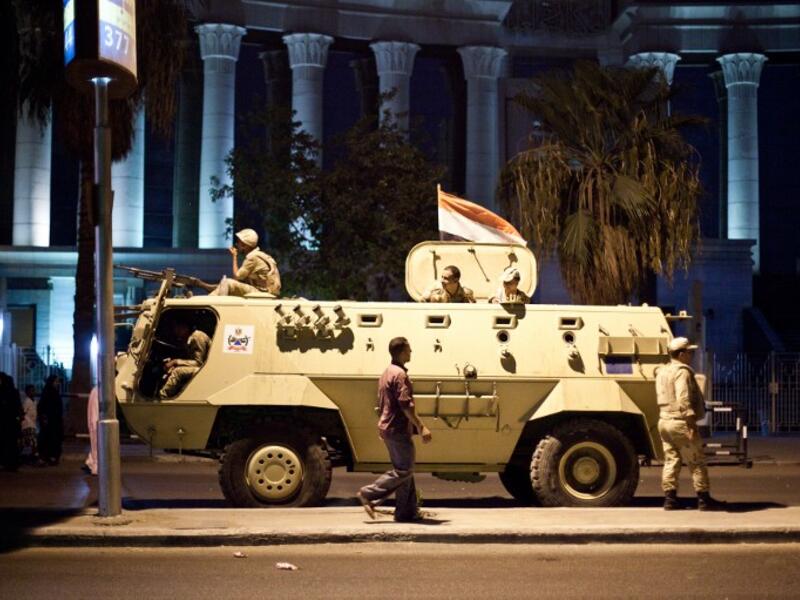 An Egyptian army armoured vehicle is seen in front of the Supreme Constitutional Court in Cairo ahead of planned demonstrations on August 18, 2013. (AFP)