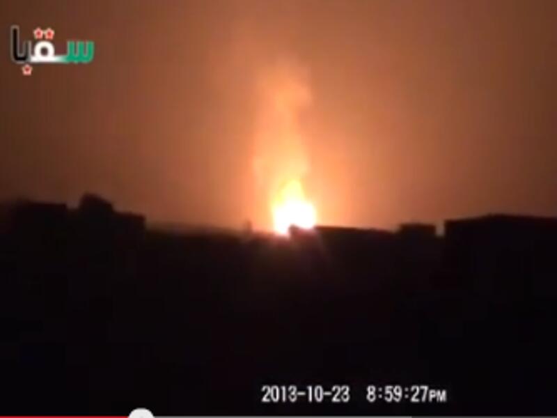 An image grab from a YouTube video shows a huge blaze burning near what activists say is Damascus airport. The explosion which caused the blaze triggered a capital-wide blackout on Wednesday evening, which is only just being repaired. (YouTube)
