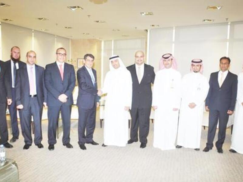 Emile Habib of Gulf Related with Yasir Abu Sulayman of NCB and senior executives.