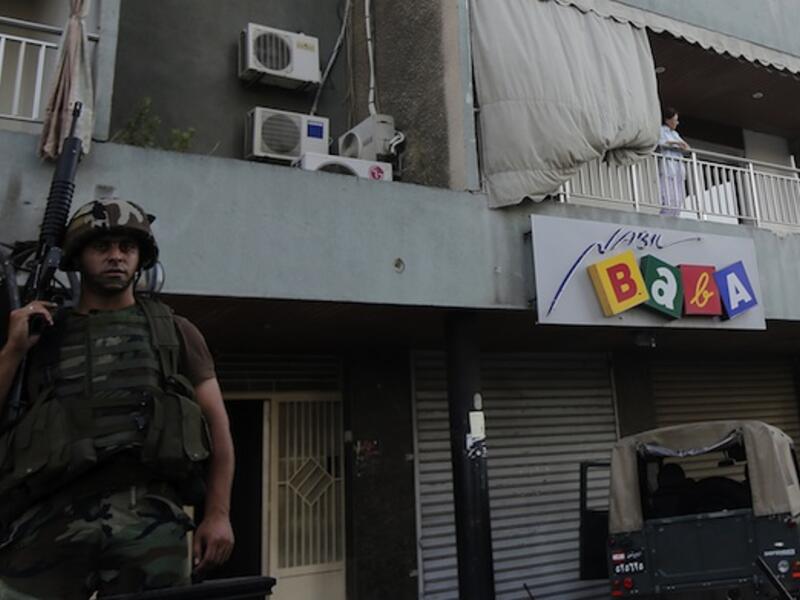 A Lebanese army soldier monitors as they perform search operations in the Abra district of the southern Lebanese city of Sidon on Monday. (AFP)
