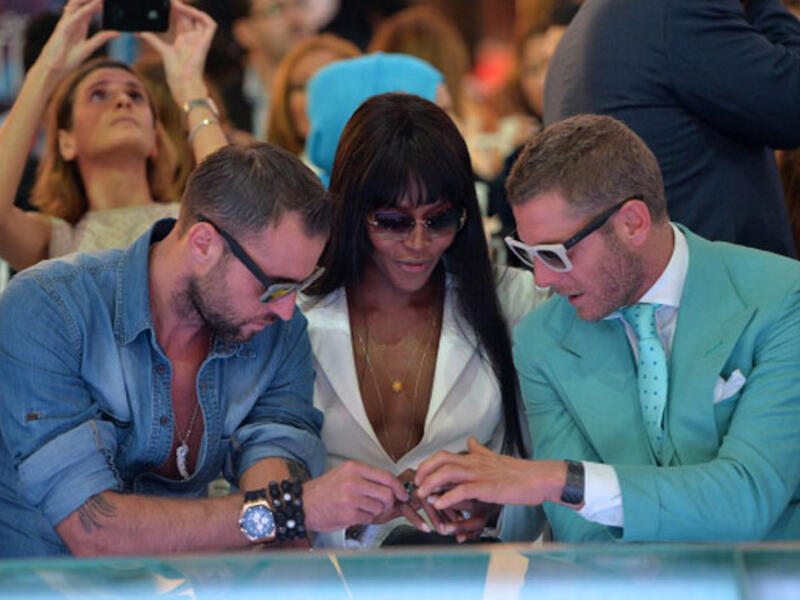 Supermodel Naomi Campbell and fashion designers D Squared sitting in front row at a fashion show on Dubai Mall's catwalk. (Image: Samir Hussein/Getty Images for Vogue and The Dubai Mall)
