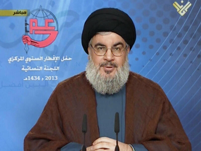 Hassan Nasrallah, the head of Lebanon's militant Shiite Muslim movement Hezbollah, giving a televised address from an undisclosed location on July 24, 2013 (AFP/AL-MANAR)
