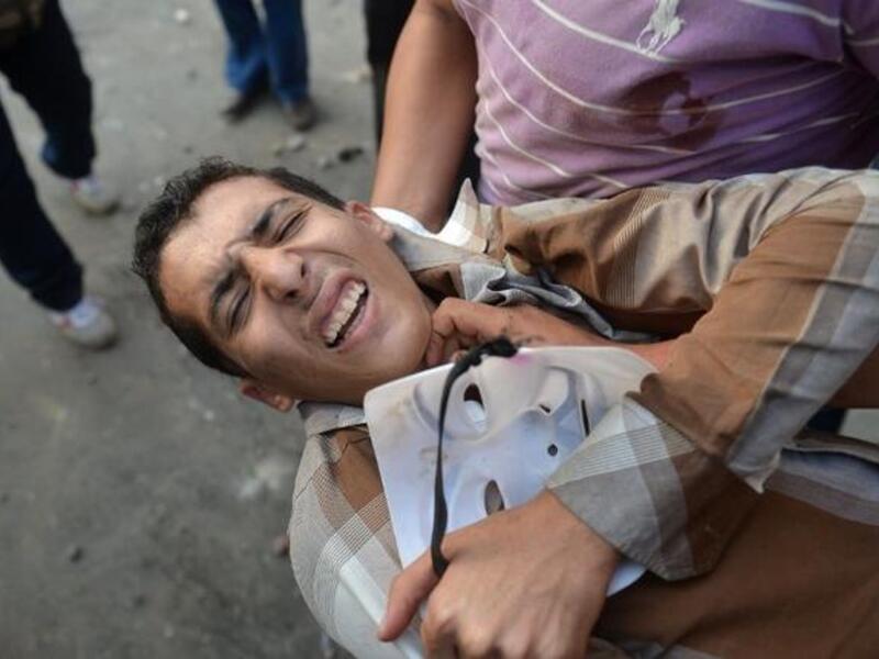 The wounded carried away from Tahrir after the clashes on Friday