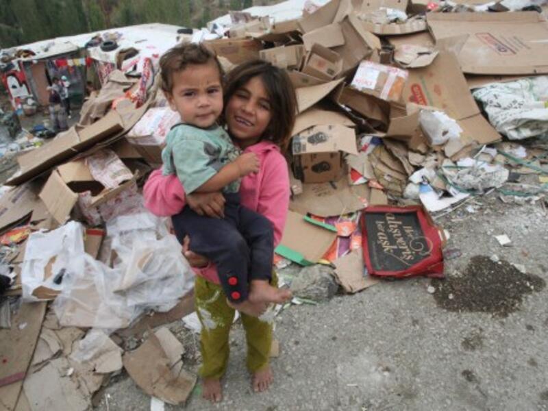 Syrian children refugees, who flock by dozens in Turkey each day, fleeing the civil war in their country, stand on October 4, 2013 at a makeshift camp in Ankara, where they arrived three months ago. Europe is bracing itself for a major Syrian refugee influx. (AFP)
