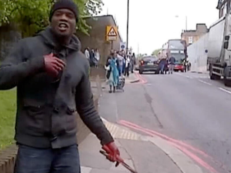 A screen grab of one of the suspects wielding a knife after beheading a man in London on Wednesday. 