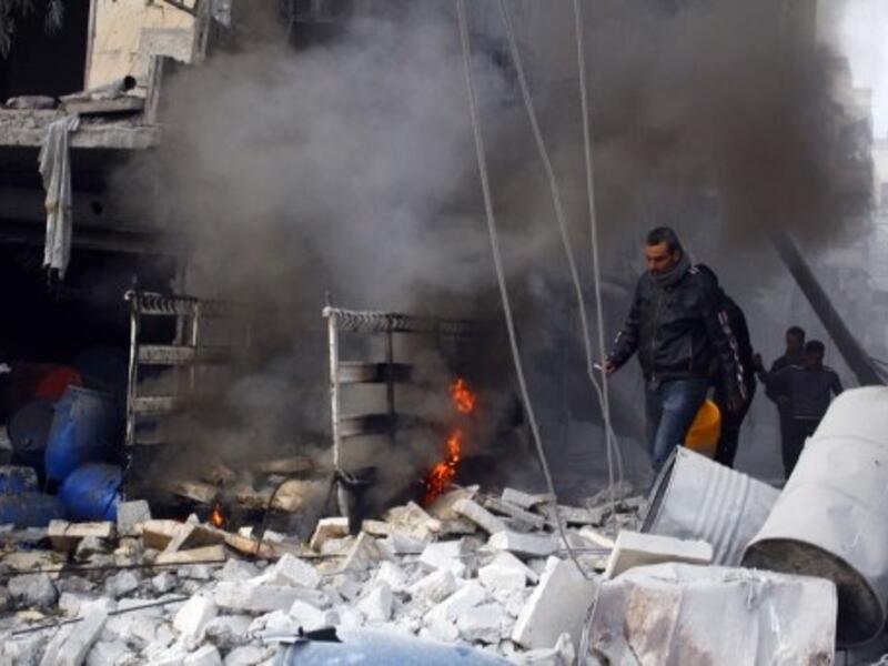 Regime airstrikes targeting a rebel compound left 26 dead Saturday after the attack missed its target and hit the nearby Nafasin market (Mohammed Al Khatieb/AFP)