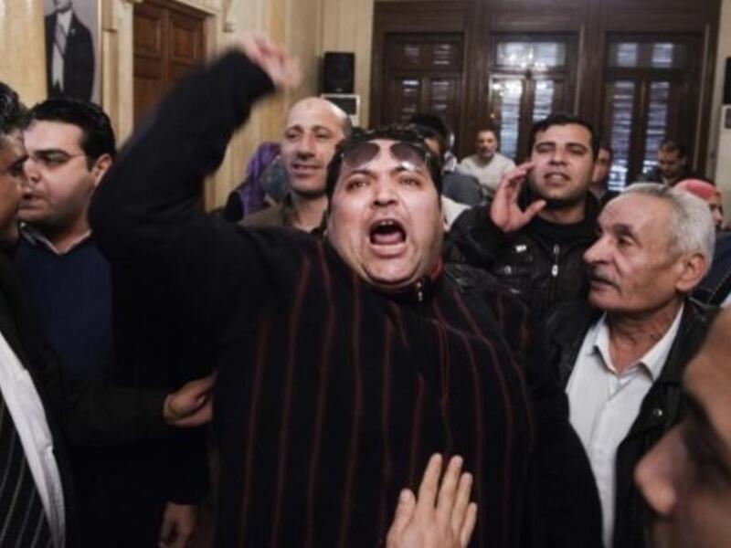 An unidentified Egyptian man shouts slogans against Egypt's President Mohamed Morsi and in support of an election boycott during a meeting of leaders from the Egyptian National Salvation Front (NSF) in Cairo in February. (Photo: AFP / Gianluigi Guercia)