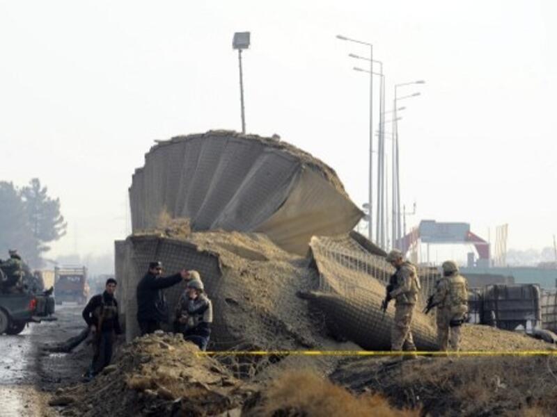 Soldiers guard the site where a Taliban suicide bomber detonated a car bomb earlier this week near the Kabul airport (Aref Karimi/AFP)