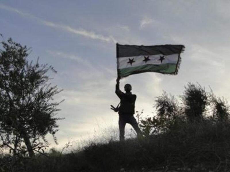 A Lebanese judge has issued an arrest warrant for a defected Syrian army colonel after he admitted to attempting to form an anti-Assad rebel brigade in north Lebanon. (AFP/File)