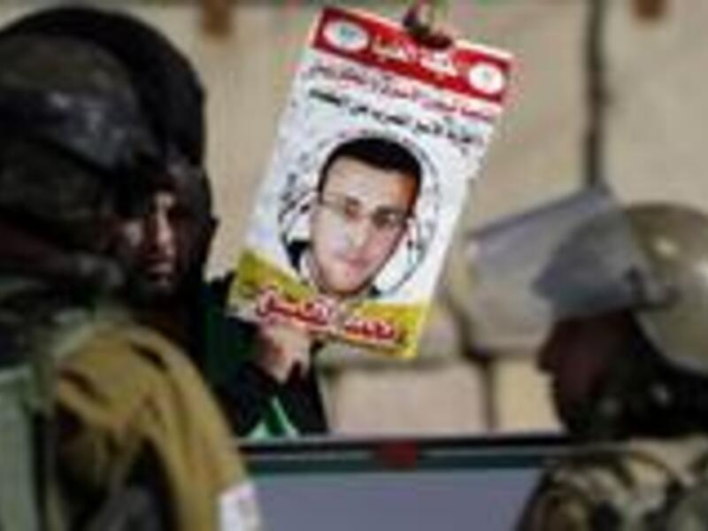 Mohammed al-Qiq, an imprisoned Palestinian journalist who has been on hunger strike for 72 days, says he has rejected Israel's decision to temporarily suspend his administrative detention. (AFP/File)