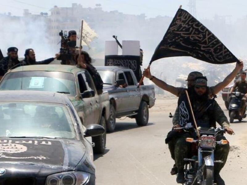 Nusra Front fighters back in the day before Thursday when they became Jabhat Fatah al-Sham (AFP/Fadi al-Halabi)