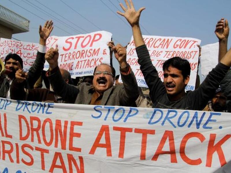 Activists from the Muttahida Shehri Mahaz shout slogans as they protest against a US drone attack in Multan on December 26, 2103. [AFP]
