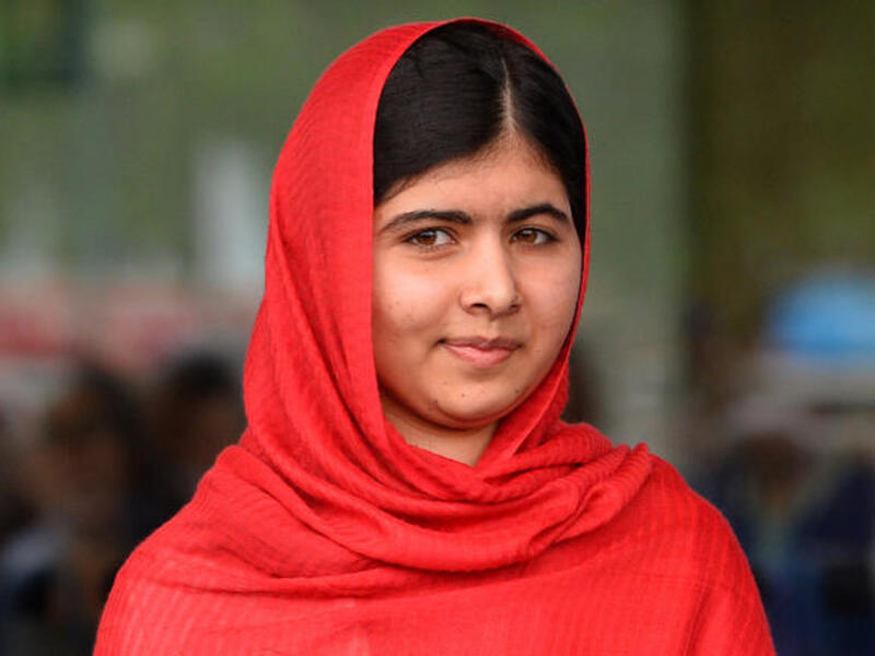 Photo taken on September 3, 2013 shows Malala Yousafzai, the 16-year-old Pakistani advocate for girls education who was shot in the head by the Taliban in 2012, opening the Library of Birmingham. (Image credit: AFP)