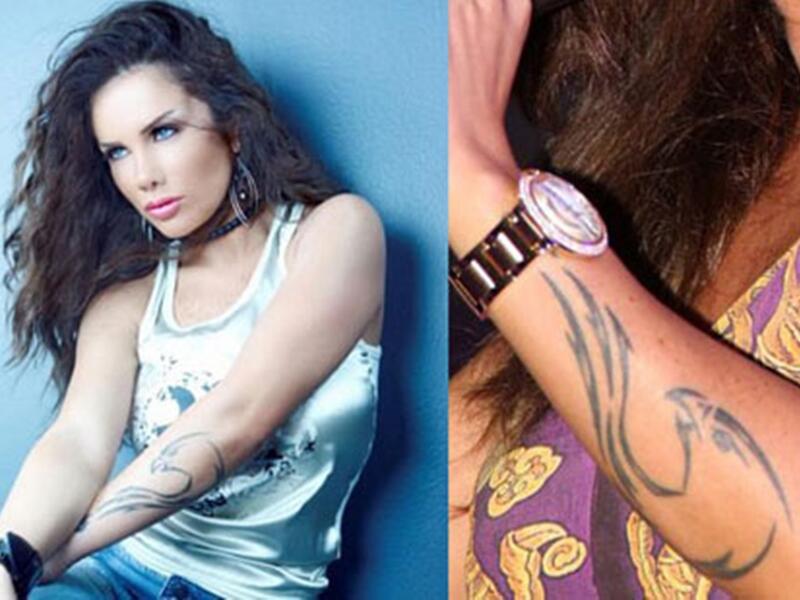 الفنانة اللبنانية نيكول سابا رسمت تاتو مميز وغريب لشكل تنين على طول ذراعها
