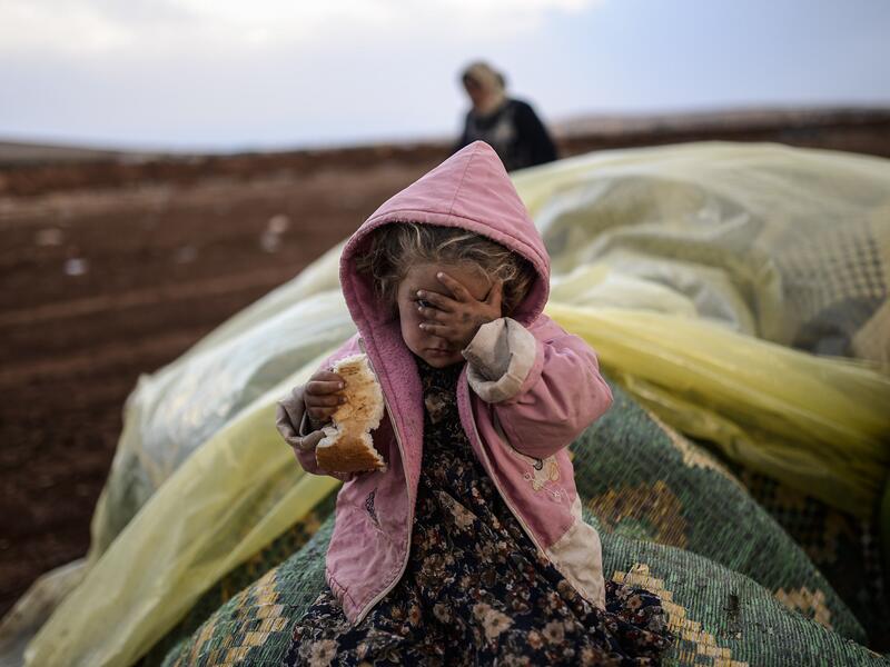 "All they want is taking pictures," says a Jordanian man of the many aid organizations in his country trying to help Syrian refugees.  Aid workers, often foreign and unaware of local customs, tend to bring with them an unbalanced power dynamic when working with refugees, writes Ann-Christin Wagner.  (AFP/Bulent Kilic)