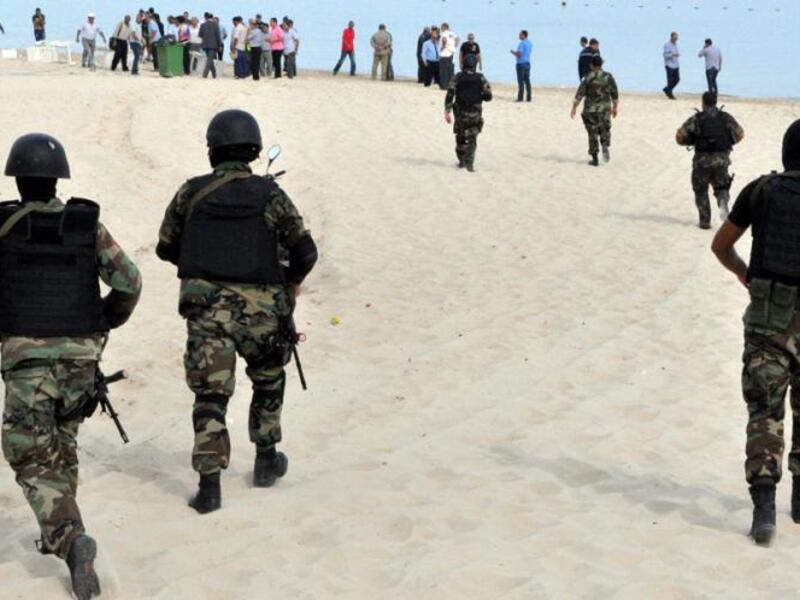 Tunisian security personnel monitor the beach following the 2015 Sousse mass shooting which killed 38 at a tourist resort (AFP)