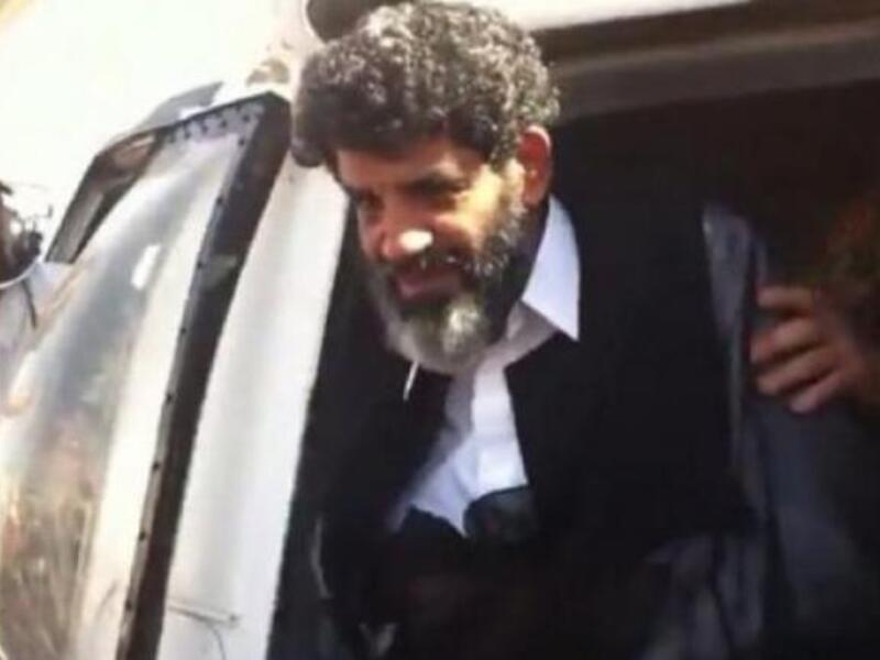 Abdullah al-Senussi arrives at a prison in Tripoli on September 5, 2012 (AFP file photo)