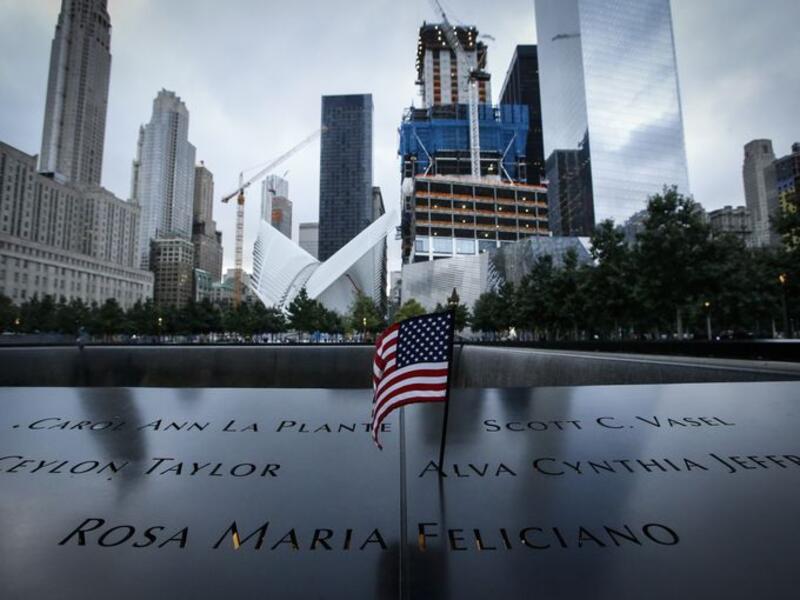 A US flag is placed on the 9/11 memorial before the ceremony to commemorate the 14th Anniversary of the terrorist attacks on Sept. 11, 2015 in New York. (AFP/Kena Betancur)