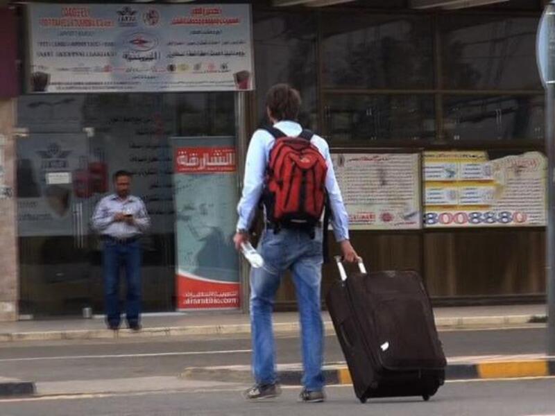 YEMEN, SANAA : An image grab taken from an AFPTV video shows people heading to Sanaa International Airport as they prepare to leave Yemen on August 6, 2013. The United States ordered Americans to leave Yemen "immediately" amid a worldwide alert linked to electronic intercepts from Al-Qaeda leader Ayman al-Zawahiri. AFP PHOTO/AFPTV