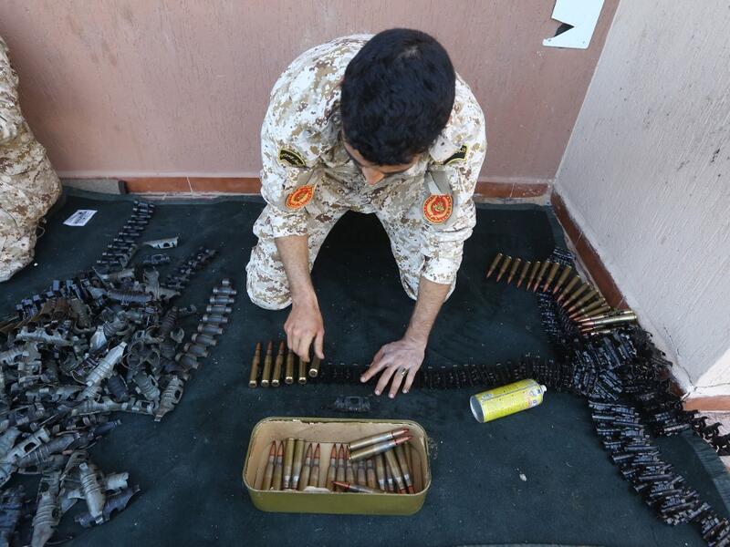 Fighters from a Misrata armed group loyal to the internationally recognised Libyan GNA prepare their ammunition before heading to the frontline as battles against Forces of Libyan strongman Khalifa Haftar continue on the outskirts of the capital Tripoli on April 9, 2019. Mahmud TURKIA / AFP