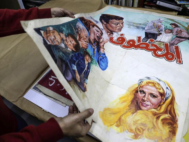 In a Beirut cultural centre, Lebanese film buff Abboudi Abu Jawdeh is exhibiting vintage film posters from his collection that show off a lost art, but also offer insight into decades of Western cliches of the Arab world. JOSEPH EID / AFP