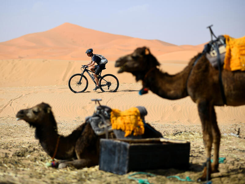 A competitor rides during a training session on April 27, 2019, on the eve of the start of the 14rd edition of Titan Desert 2019 around Merzouga in Morocco. Titan desert 2019, a mountain bike race (640km) snakes between Merzouga and Maadid from April 28 to May 3. FRANCK FIFE / AFP