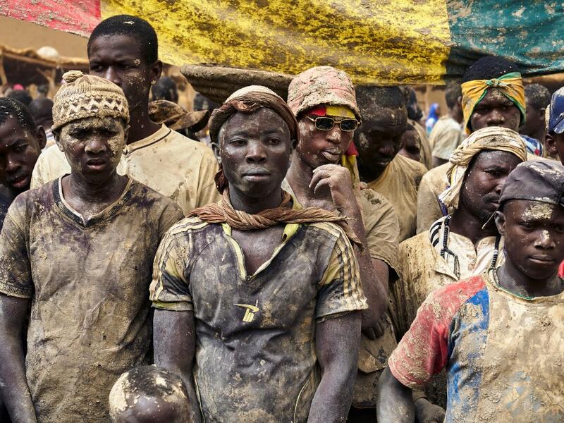 People take part in the annual rendering of the Great Mosque of Djenne in central Mali  MICHELE CATTANI / AFP