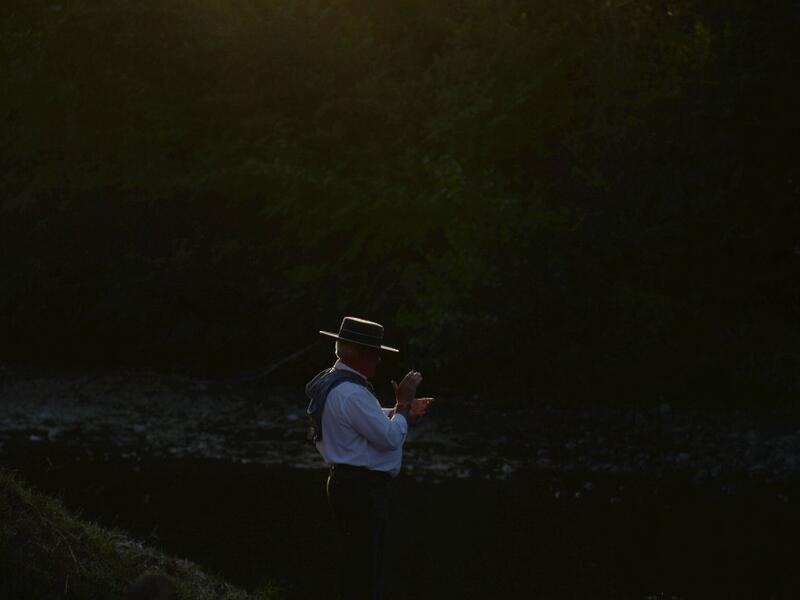 A pilgrim walks by an effigy of a Virgin near the Quema river in Villamanrique, during a pilgrimage to the village of El Rocio. CRISTINA QUICLER / AFP