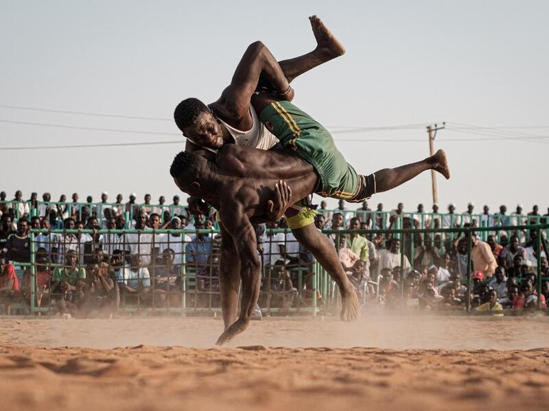 Originating in the Nuba mountains, the sport has become wildly popular country-wide in recent years. The Sudanese Nuba wrestling federation organizes matches every Friday that attract hundreds of people. Yasuyoshi CHIBA / AFP