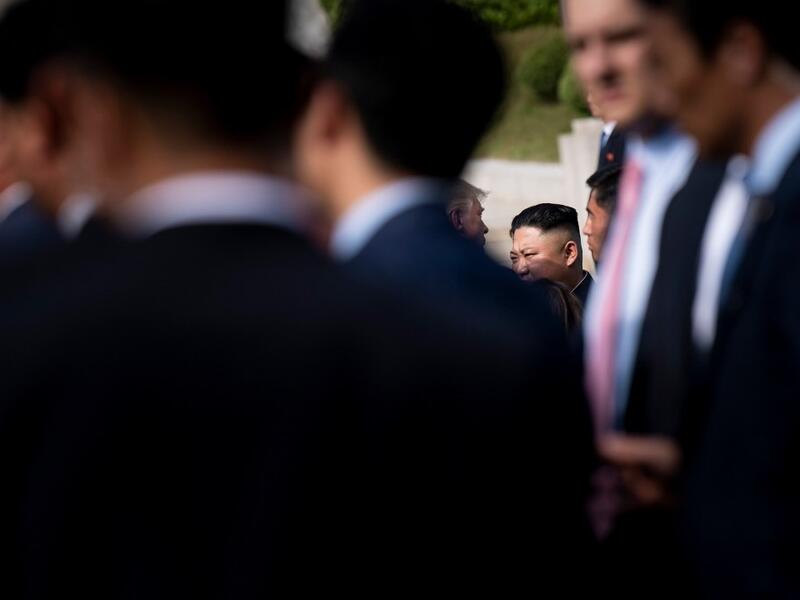 US President Donald Trump and North Korea's leader Kim Jong-un speak near the line of demarcation after meeting in the Demilitarized Zone(DMZ) on June 30, 2019.  Brendan Smialowski / AFP