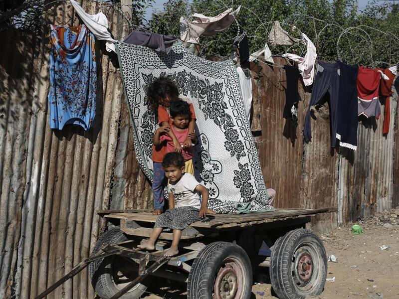 Palestinian children play at an impoverished neighbourhood in Gaza City on July 4, 2019.  MOHAMMED ABED / AFP