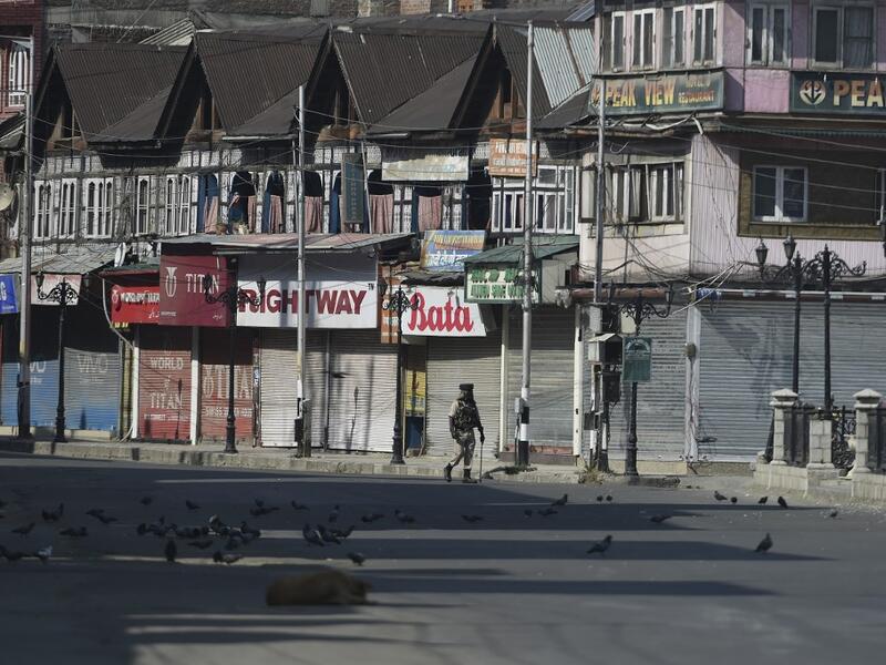 An Indian paramilitary trooper patrols along an empty street during a strict curfew in Lal Chowk area of Srinagar on the 8th day of Muharram (AFP) An Indian paramilitary trooper patrols along an empty street during a strict curfew in Lal Chowk area of Srinagar on the 8th day of Muharram (AFP)