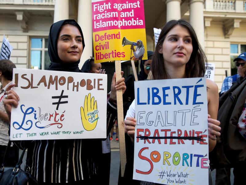 Women join a demonstration organised by "Stand up to Racism" outside the French Embassy in London on 26 August, 2016 /AFP