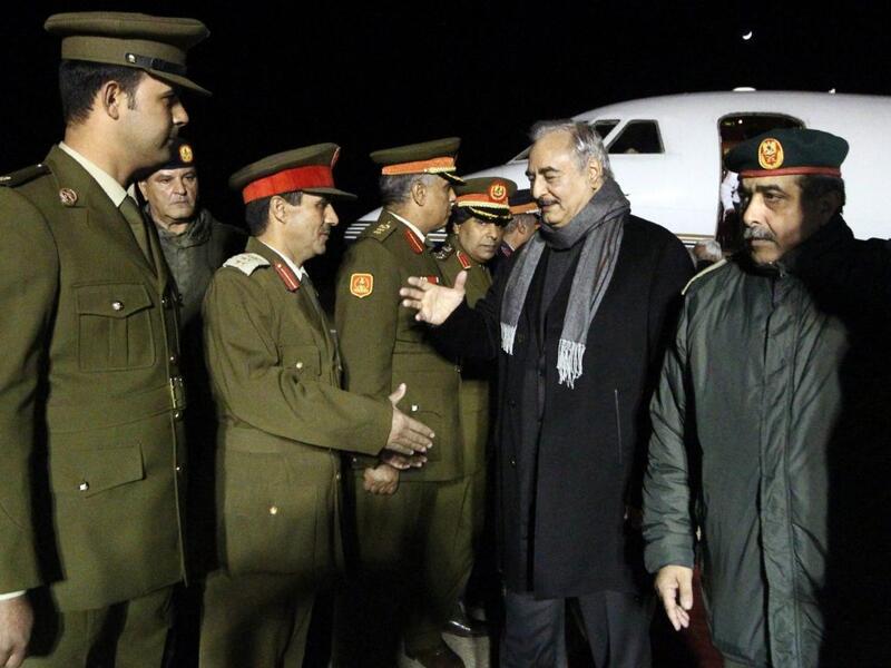 Khalifa Haftar, second from right, the military leader of the so-called Libyan National Army, is greeted after a trip to Russia /AFP  Khalifa Haftar, second from right, the military leader of the so-called Libyan National Army, is greeted after a trip to Russia /AFP