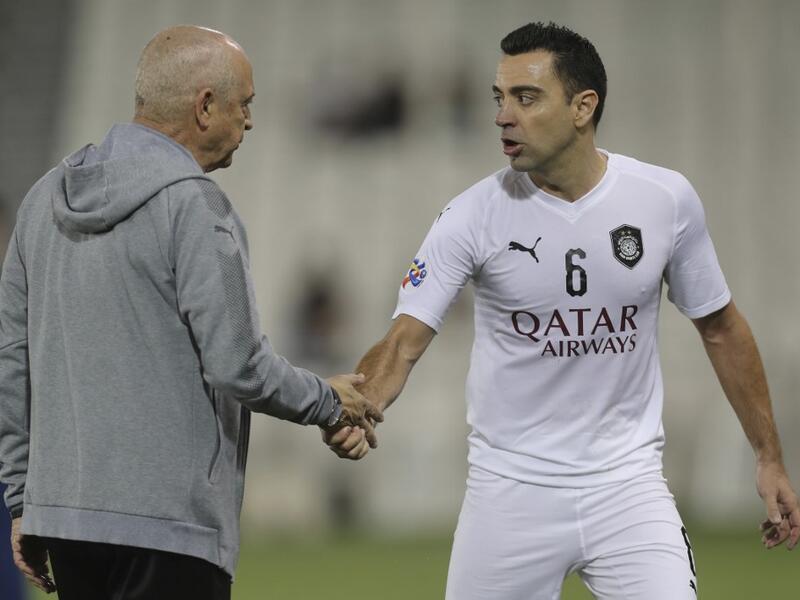 Coach Jesualdo Ferreira and Xavi