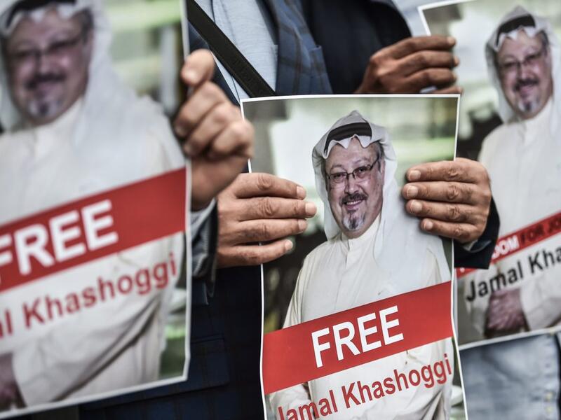 Protestors hold pictures of missing journalist Jamal Khashoggi during a demonstration in front of the Saudi Arabian consulate on October 8, 2018 in Istanbul. (Ozan Kose/AFP via Getty Images)