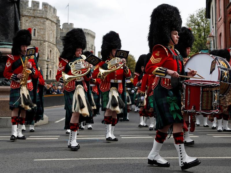 Members of the Band of the Royal Regiment of Scotland perform in the Changing of the Guard ceremony at Windsor Castle in Windsor, west of London on May 7, 2019. ADRIAN DENNIS / AFP